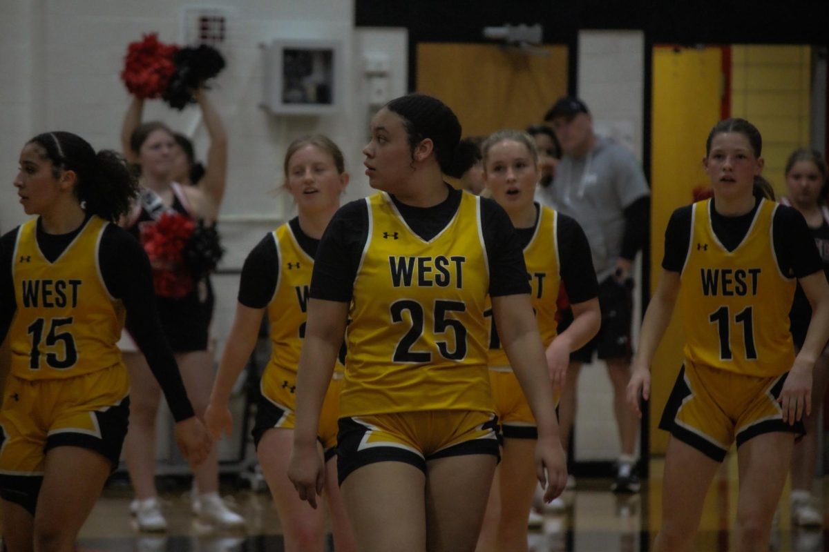 Aliyah Jones, Lydia Safly, Morgan Chiarello, Kate Van Dementer, and Izzy Joyce walking across the court after scoring on the opposing team.